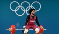 Qatar's Faris Ibrahim E Elbakh fails in the men's -102kg weightlifting event during the Paris 2024 Olympic Games at the South Paris Arena in Paris, on August 10, 2024. (Photo by ARUN SANKAR / AFP)
