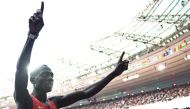 Gold medallist Kenya's Emmanuel Wanyonyi celebrates after the men's 800m final of the athletics event at the Paris 2024 Olympic Games at Stade de France in Saint-Denis, north of Paris, on August 10, 2024. (Photo by Anne-Christine POUJOULAT / AFP)
