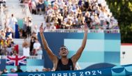 Egypt's Ahmed Elgendy crosses the finish line and wins the men's modern pentathlon during the Paris 2024 Olympic Games at the Chateau de Versailles in Versailles on August 10, 2024. (Photo by Miguel MEDINA / AFP)
