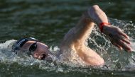 Germany's Florian Wellbrock swims in the Seine river during the men's 10km marathon swimming final at the Paris 2024 Olympic Games at Pont Alexandre III in Paris on August 9, 2024. Photo by Dimitar DILKOFF / AFP.