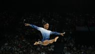 US' Simone Biles competes in the artistic gymnastics women's balance beam final during the Paris 2024 Olympic Games at the Bercy Arena in Paris, on August 5, 2024. (Photo by Gabriel BOUYS / AFP)
