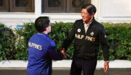 Philippines' Carlos Yulo (L), Paris 2024 Olympic Games double gold medalist in gymnastics shakes hands with President Ferdinand Marcos Jr. upon his arrival at the Malacanang presidential palace in Manila on August 13, 2024. (Photo by Basilio H SEPE / POOL / AFP)
