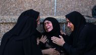 A Palestinian woman mourns a family member killed in Israeli bombardment, at the Nasser hospital in Khan Yunis in the southern Gaza Strip on August 14, 2024. (Photo by Bashar Taleb / AFP)