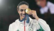 Algeria's Imane Khelif poses with her gold medal.