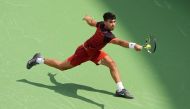 Carlos Alcaraz of Spain plays a backhand during his match against Gael Monfils of France during Day 6 of the Cincinnati Open at the Lindner Family Tennis Center on August 16, 2024 in Mason, Ohio. (Photo by Dylan Buell / GETTY IMAGES NORTH AMERICA / Getty Images via AFP)
