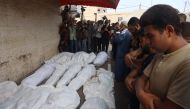 Palestinians mourn their relatives, killed in an Israeli strike, at the Al-Aqsa Martyrs hospital in Deir el-Balah in the central Gaza Strip on August 17, 2024. (Photo by Eyad BABA / AFP)
