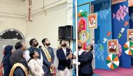 Guests and officials unfurl the Indian national flag on the occasion.