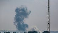 This picture taken from Deir al-Balah in the central Gaza Strip shows smoke billowing southeast of the city following Israeli bombardment on August 17, 2024. Photo by Bashar TALEB / AFP.