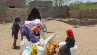 Displaced Yemenis affected by recent floods receive humanitarian in the Hays region, south of Hodeidah Governorate, west of August 16, 2024. (Photo by Khaled Ziad / AFP)
