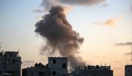 Smoke rises as Israeli troops target a building in the Nuseirat refugee camp in the central Gaza Strip on August 22, 2024. Photo by Eyad BABA / AFP.