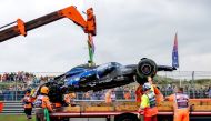 The car of Williams' US driver Logan Sargeant is lifted after a crash during the third practice session at The Circuit Zandvoort, western Netherlands, on August 24, 2024, ahead of the Formula One Dutch Grand Prix. (Photo by Remko de Waal / ANP / AFP) / Netherlands OUT