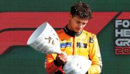 Winner McLaren’s British driver Lando Norris celebrates during the podium ceremony.