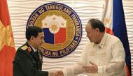 Vietnam's Minister of Defence General Phan Van Giang (left) and Philippines' Defence Secretary Gilberto Teodoro after delivering their joint statements at the Department of National Defense office in Manila on August 30, 2024. (Photo by Ted Aljibe / AFP)