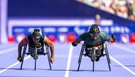 Qatar’s Ali Arshad (L) during the final of men’s 100m T34 racing event at the Paris 2024 Paralympic Games.

