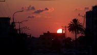 The sun sets over Tulkarem during an Israeli military raid on the northern city and its refugee camp in the occupied West Bank on September 2, 2024. (Photo by JAAFAR ASHTIYEH / AFP)
