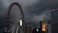 Storm clouds gather over buildings in Hong Kong on September 5, 2024, as super typhoon Yagi tracked across the South China Sea towards the southern China coast. (Photo by Peter PARKS / AFP)