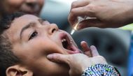 A child receives a vaccination for polio in Khan Yunis in the southern Gaza Strip on September 5, 2024. Photo by Bashar TALEB / AFP