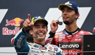 Winner Gresini Racing MotoGP's Spanish rider Marc Marquez and third placed Ducati Lenovo Team's Italian rider Enea Bastianini celebrate on the podium after the MotoGP race at the Misano World Circuit Marco-Simoncelli in Misano Adriatico on September 8, 2024. Photo by Gabriel BOUYS / AFP.