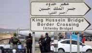 Israeli security forces gather at the scene of a reported attack near the Allenby Crossing between the occupied West Bank and Jordan on September 8, 2024, where the Israeli military said a truck driver opened fire, killing three Israelis. The (Photo by Ahmad GHARABLI / AFP)
