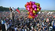 Activists of Pakistan Tehreek-e-Insaf (PTI) party of former country's prime minister Imran Khan, take part in a public rally on the outskirts of Islamabad on September 8, 2024. (Photo by Farooq Naeem / AFP)