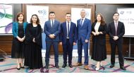 Speakers pose for a group photo during the Qatar Digital Trust Roadshow 2024.