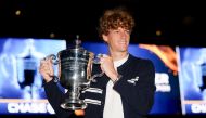 Jannik Sinner of Italy poses for a photo with the winners trophy outside of Arthur Ashe Stadium at USTA Billie Jean King National Tennis Center on September 08, 2024. Matthew Stockman/Getty Images/AFP