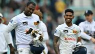 Sri Lanka's Pathum Nissanka (R) and Sri Lanka's Angelo Mathews walk off the pitch after winning on day four of the third cricket test match between England and Sri Lanka at The Oval cricket ground in London on September 9, 2024. Sri Lanka beat England by eight wickets in third Test. (Photo by Glyn KIRK / AFP) /