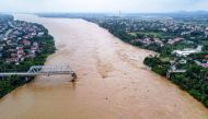 This aerial picture shows the collapsed Phong Chau bridge over the Red River in Phu Tho province on September 9, 2024, after Super Typhoon Yagi hit northern Vietnam. (Photo by AFP)

