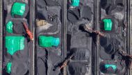 (Files) Coal is sorted into piles at a coal yard at the port in Ningbo, in China's eastern Zhejiang province on July 16, 2024. (Photo by AFP) 