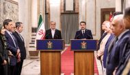 Iran's President Masoud Pezeshkian and Iraq's Prime Minister Mohammed Shia al-Sudani give a press conference after their meeting at the government palace in Baghdad on September 11, 2024. (Photo by Ahmed Jalil/ Pool / AFP)