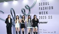 K-pop girl group NewJeans members pose on the blue carpet at the 2025 Spring/Summer Seoul Fashion Week at Dongdaemun Design Plaza in Seoul on September 3, 2024. (Photo by Jung Yeon-je / AFP)
