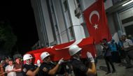 Coffin of US-Turkish activist Aysenur Ezgi Eygi is carried by Turkish honor guard police officers to a morgue at the Didim district in Aydin on September 13, 2024. (Photo by Ozan Kose / AFP)