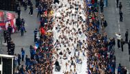 French athletes who participated in the 2024 Olympics and Paralympics walk on a catwalk at the Avenue des Champs-Elysees, in Paris, France September 14, 2024. Photo by Gonzalo Fuentes / POOL / AFP.