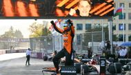 McLaren's Australian driver Oscar Piastri celebrates after winning the Formula One Azerbaijan Grand Prix at the Baku City Circuit in Baku on September 15, 2024. (Photo by Andrej ISAKOVIC / AFP)
