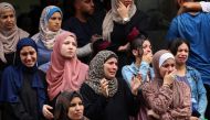 Palestinian women mourn people killed in Israeli strikes on the Bureij refugee camp, after their bodies were taken to the al-Awda Hospital at the Nuseirat refugee Camp in the central Gaza Strip on September 17, 2024. (Photo by Eyad Baba / AFP)