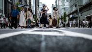 Photo used for demonstration purposes. People walk in the pedestrian zone of Tokyo's Ginza district during the 