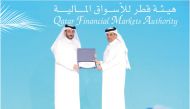 Eng. Abdulrahman Al Malki handed over the certificate to Ahmad Salem Sultan, Director of Public Relations & Communication Department at QFMA.