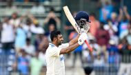 India's Ravichandran Ashwin celebrates after scoring a century (100 runs) during the first day of the first Test cricket match on September 19, 2024. (Photo by R.Satish Babu / AFP)