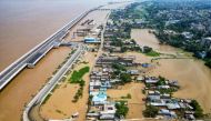 An aerial view shows houses partially submerged in flood, after rise in water level of river Ganges, in Patna on September 20, 2024. (Photo by Sachin Kumar / AFP)

