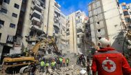 Rescuers sift through the rubble at the scene of an Israeli airstrike that targeted Beirut's southern suburbs a day earlier, as search and rescue operations continue on September 21, 2024. Photo by AFP.