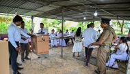  Election officials seal a ballot box at the end of voting in Sri Lanka's presidential election at a polling station in Colombo on September 21, 2024. Cash-strapped Sri Lanka voted for its next president on September 21 in an effective referendum on an unpopular International Monetary Fund austerity plan enacted after the island nation's unprecedented financial crisis. (Photo by Ishara S.KODIKARA / AFP)