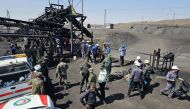 A handout picture provided by the Iranian Red Crescent (RCS) shows security forces gathered at the scene of a blast at a coal mine in Tabas on September 22, 2024. (Photo by Iranian Red Crescent / AFP) 