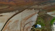 Floating houses are seen stranded in Aleixo Lake due to the severe drought in the west of Manaus, Amazonas State, Brazil, on September 20, 2024. (Photo by MICHAEL DANTAS / AFP)