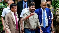 Sri Lanka's president-elect Anura Kumara Dissanayaka (C), gestures as he leaves the Election Commission office in Colombo on September 22, 2024, following his victory in the country's presidential election. Photo by Ishara S. Kodikara / AFP.