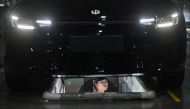  An employee works on an electric vehicle (EV) production line at the Leapmotor factory in Jinhua, China's eastern Zhejiang province on September 18, 2024. Photo by ADEK BERRY / AFP.