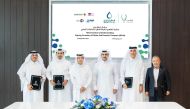 Minister of State for Energy Affairs and President and CEO of QatarEnergy, H E Saad Sherida Al Kaabi (third right) with officials of participating companies at the MoU signing ceremony yesterday.