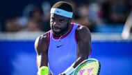 Frances Tiafoe of the US hits a return to Brandon Nakashima of the US during their men's singles match at the Japan Open tennis tournament in Tokyo on September 26, 2024. (Photo by Yuichi Yamazaki / AFP)
 