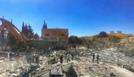 People check the rubble of destroyed buildings in Lebanon's Bekaa Valley village of Younine on September 26, 2024. (Photo by AFP)