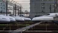 This general view taken on July 24, 2024 shows N700A and N700S series trains parked at the JR Central's Shinkansen depot in the Shinagawa district of Tokyo. (Photo by Philip Fong/ AFP) 