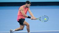 Spain’s Carlos Alcaraz hits a return to Netherlands’s Tallon Griekspoor during their men's singles match at the China Open tennis tournament in Beijing on September 29, 2024. (Photo by Jade Gao / AFP)
